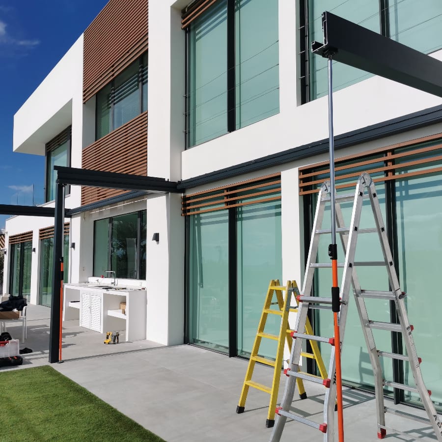 Aluminium pergola structure during installation at a modern villa